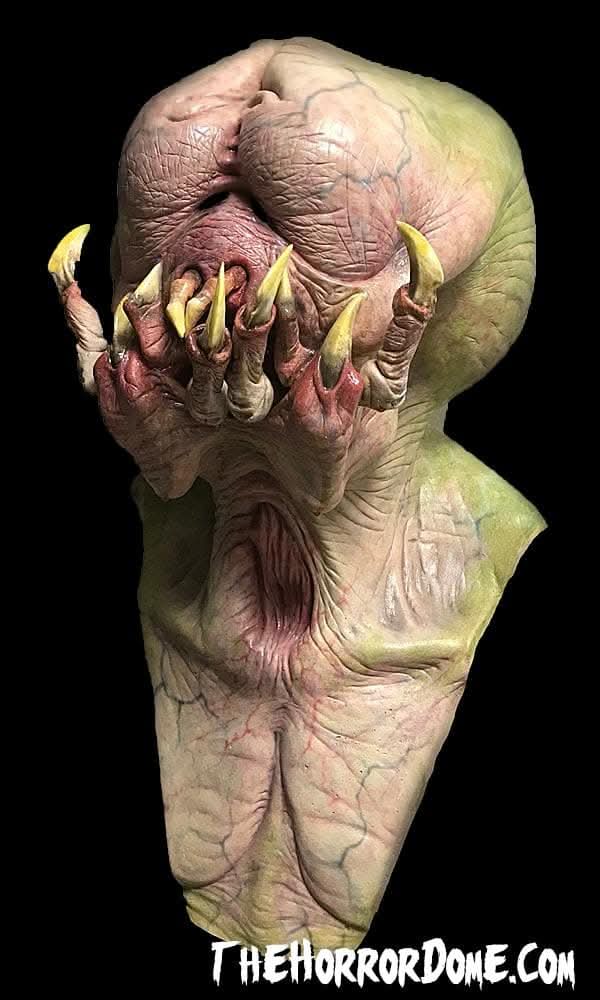 Fanged Predator Elite Halloween Mask from The Horror Dome. Hand-painted extraterrestrial disguise with powerful jaws and knife-like fangs. Seamless over-head fit over costumes. Brilliantly crafted for unearthly haunting appearances. Perfect for embodying alien horrors at costume parties and haunted houses